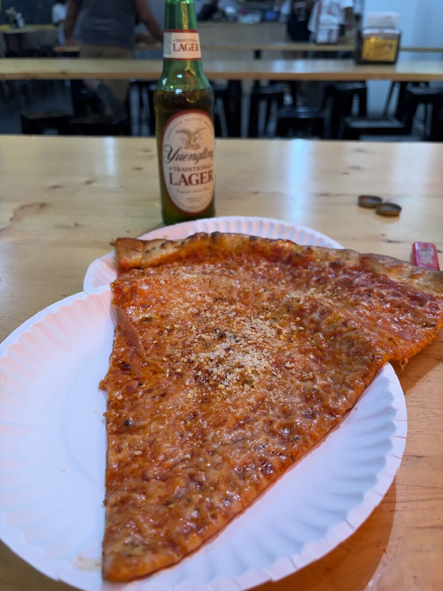 A classic slice and a Yuengling lager at Spinelli's